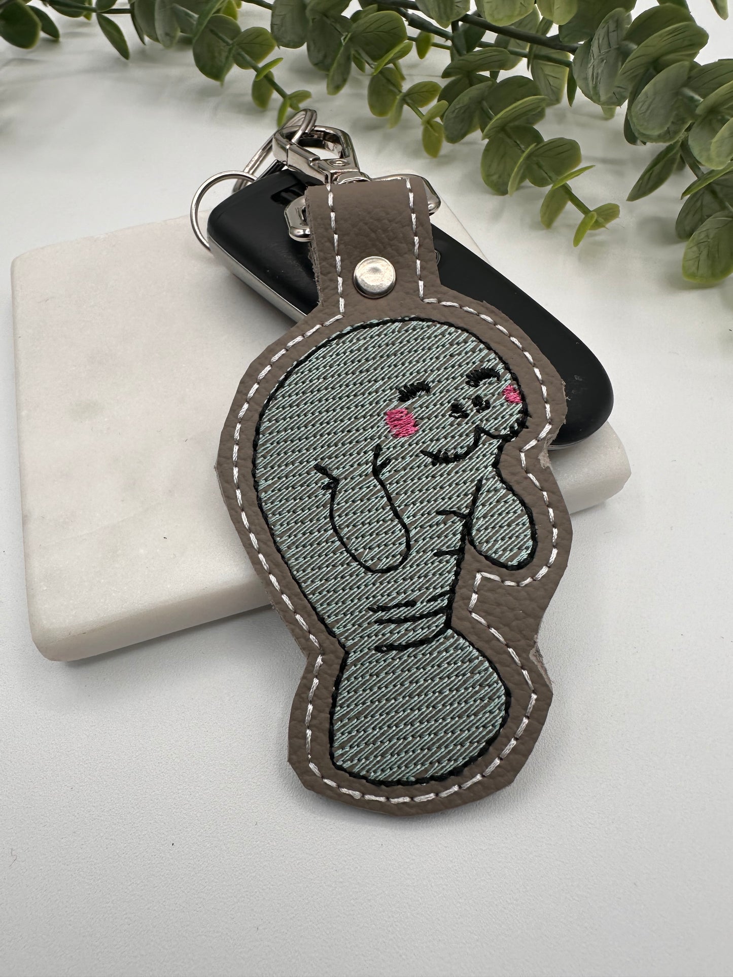 Manatee embroidered leather keychain